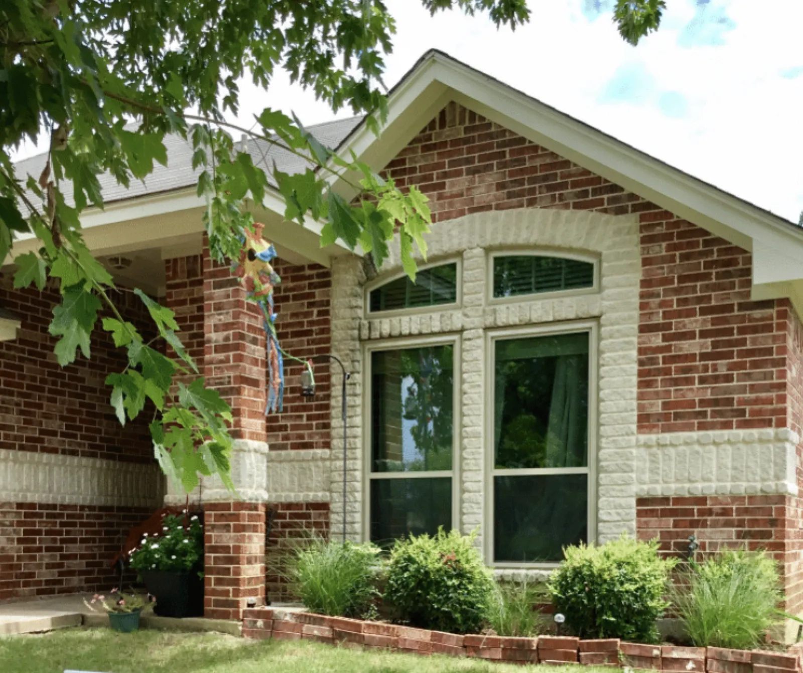 Tan vinyl replacement windows installed on a DFW home